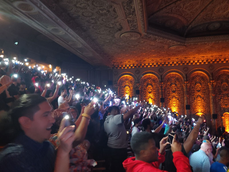 Audience at Sonic Symphony NYC raising their phone lights to 'Reach for the Stars